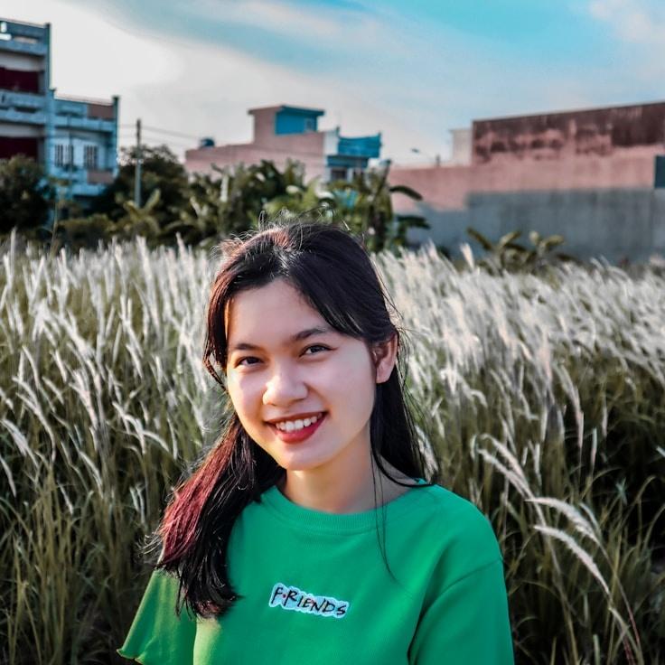 Kaveri Mehta, Lead Design Curator at Tran Quil Shore Link, reviewing corporate floral arrangements